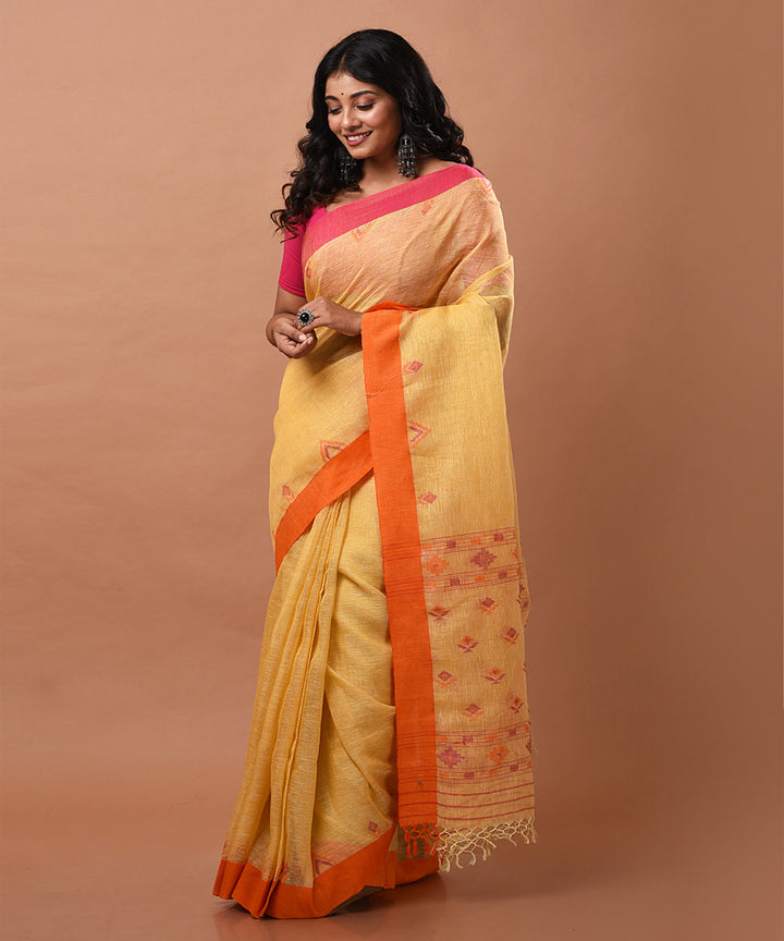 Yellow handwoven linen jamdani saree with ganga jamuna border