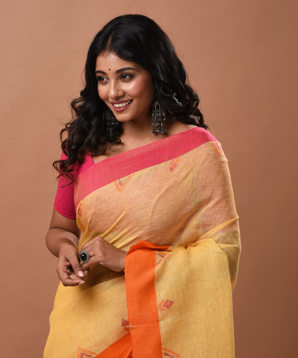 Yellow handwoven linen jamdani saree with ganga jamuna border