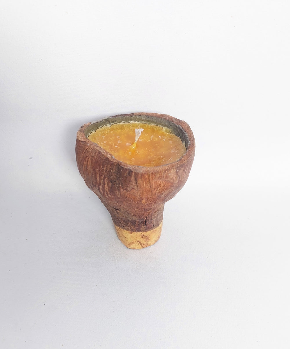 Yellow hancrafted coconut shell candle