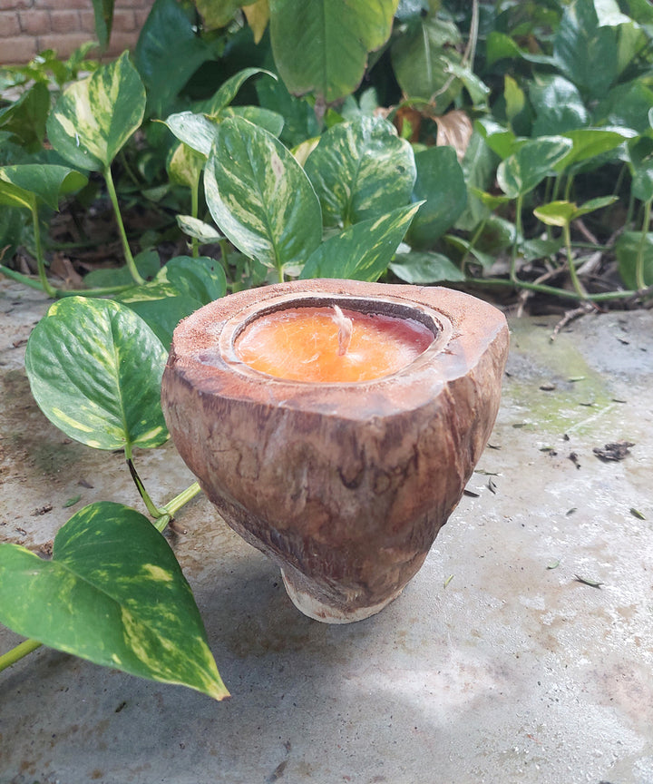 Orange hancrafted coconut shell candle