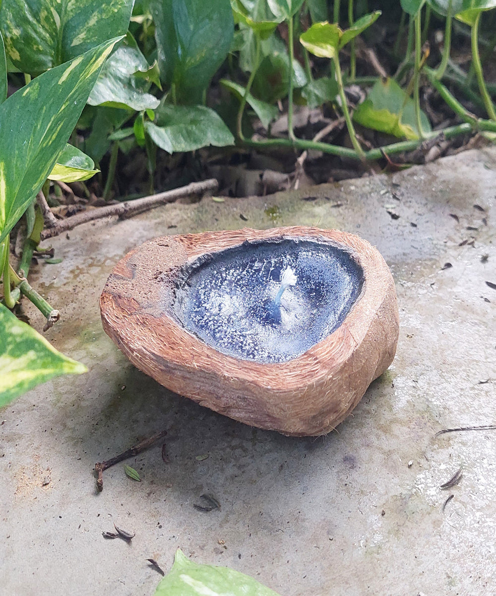 Blue handcrafted flat coconut shell candle