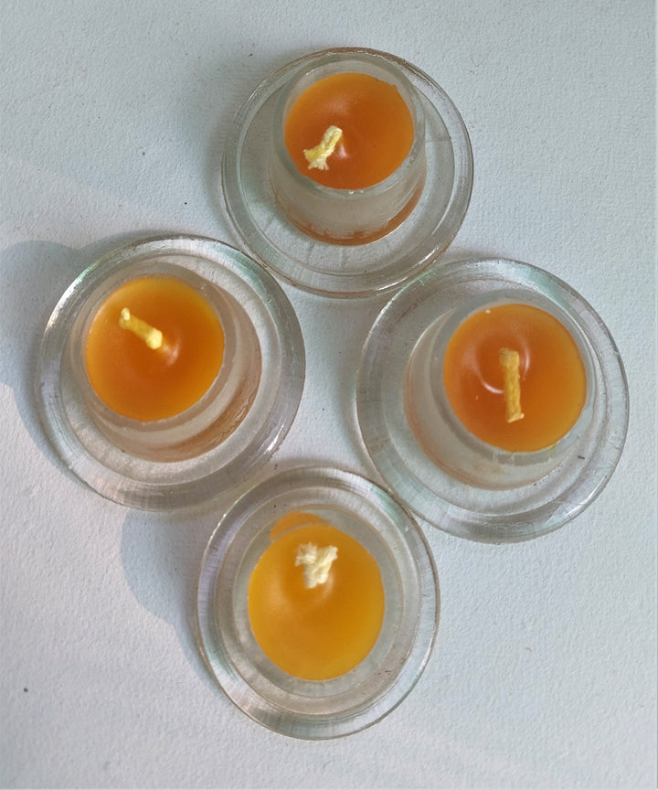 Yellow handcrafted glass candle set of 4