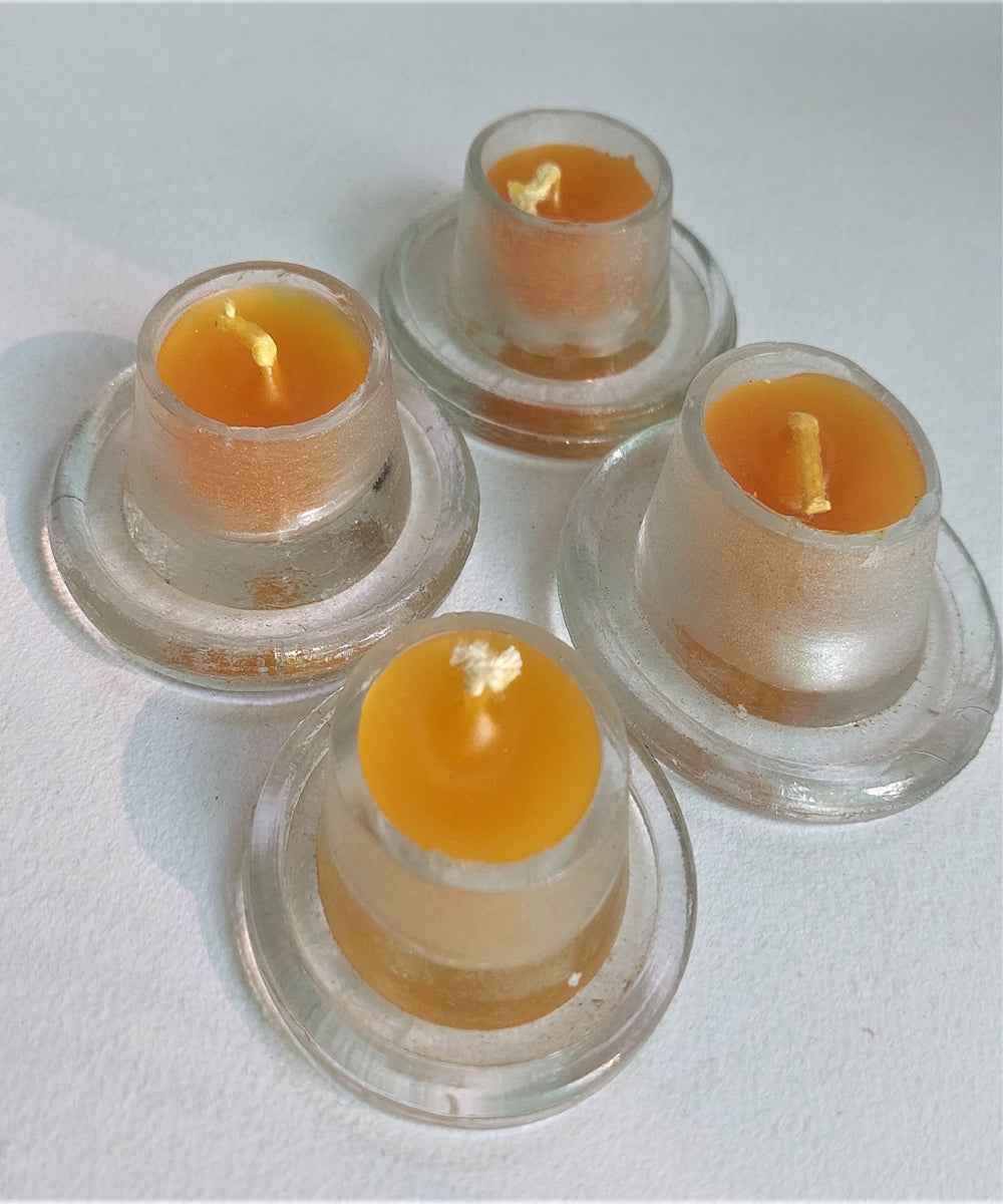 Yellow handcrafted glass candle set of 4