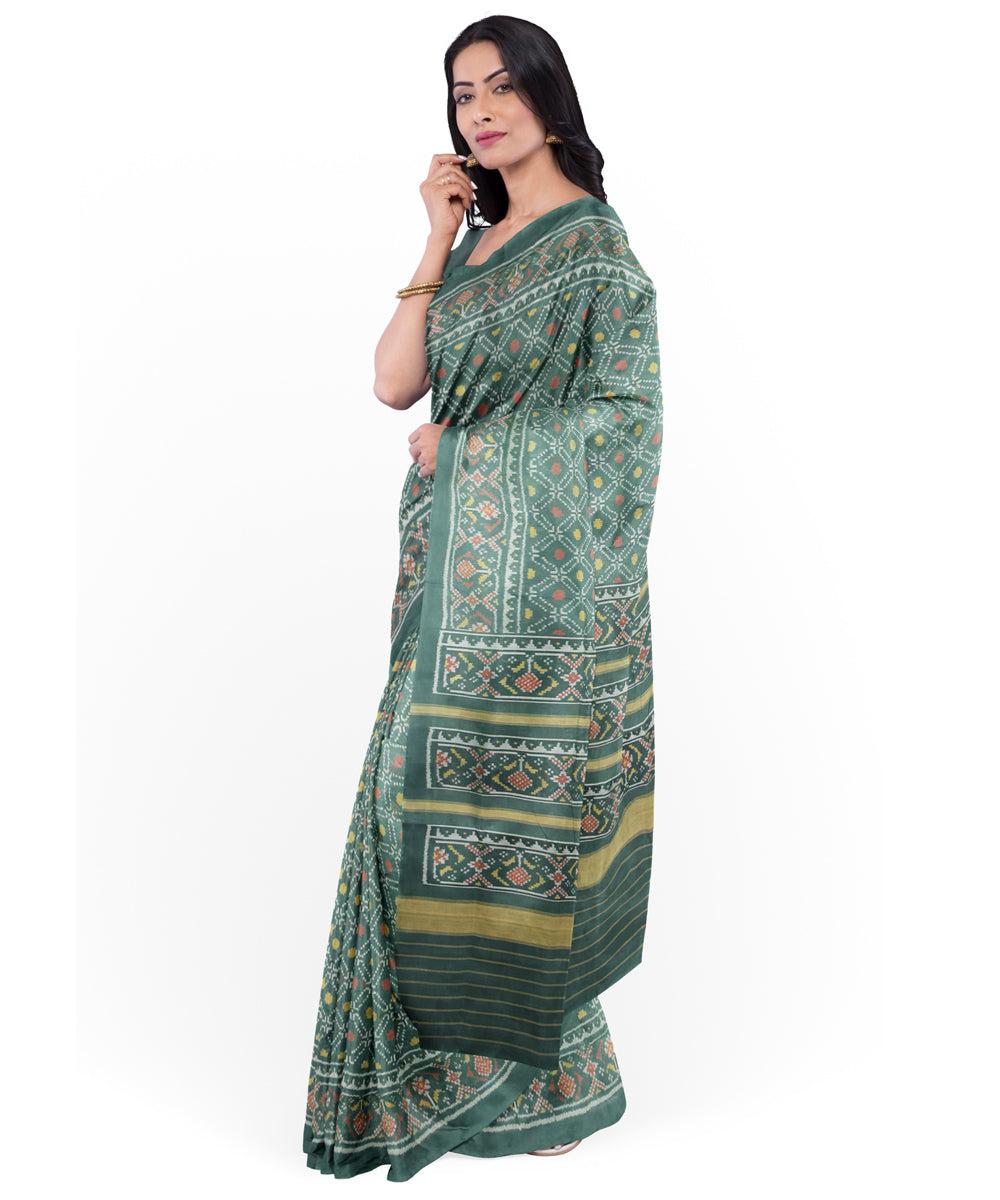 Dark green handwoven cotton patola saree