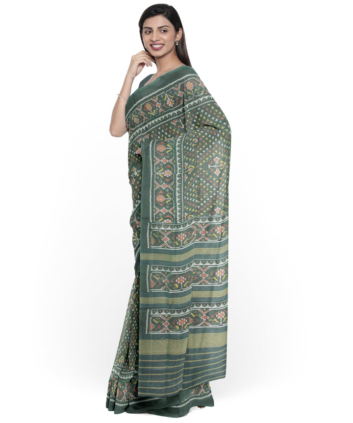 Dark green hand woven cotton patola saree