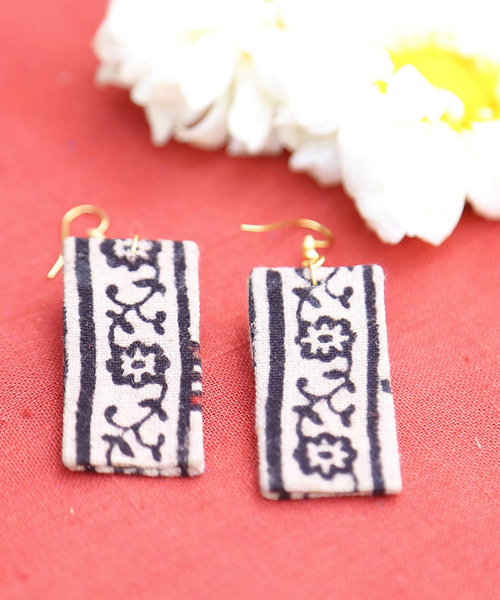 creme black floral border earrings