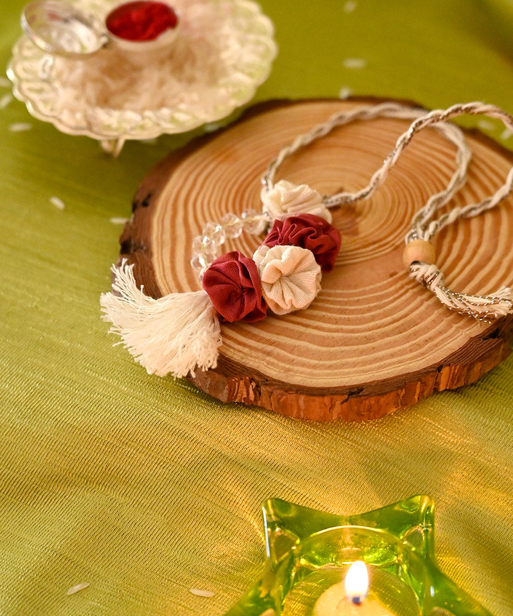 Red cream handcrafted silk rakhi