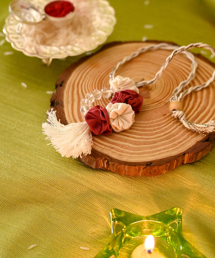 Red cream handcrafted silk rakhi