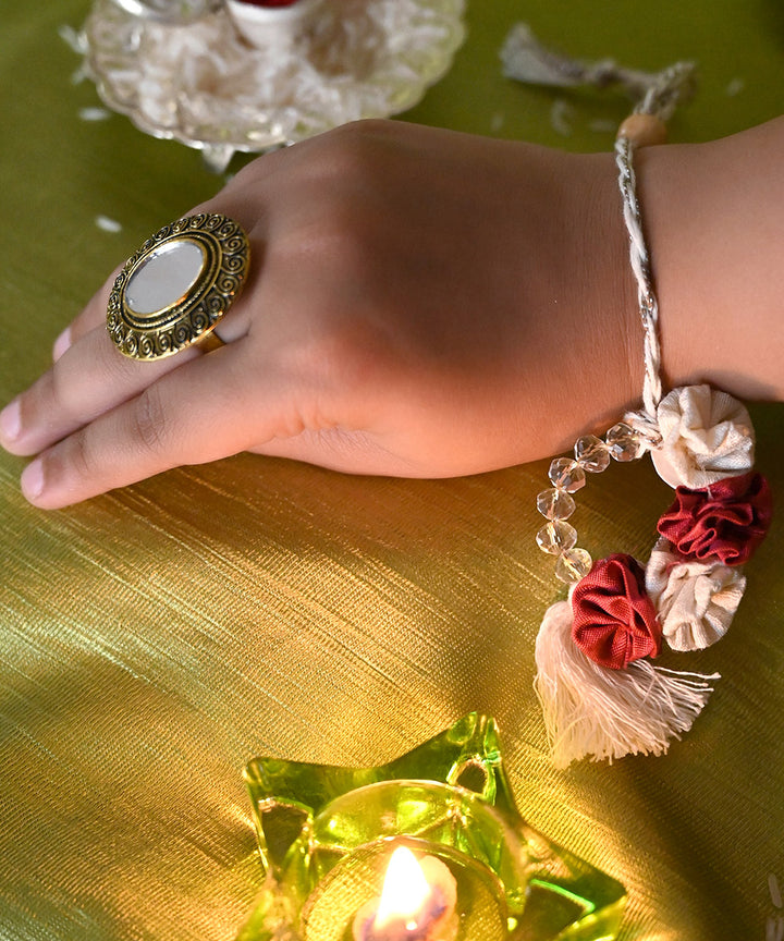 Red cream handcrafted silk rakhi