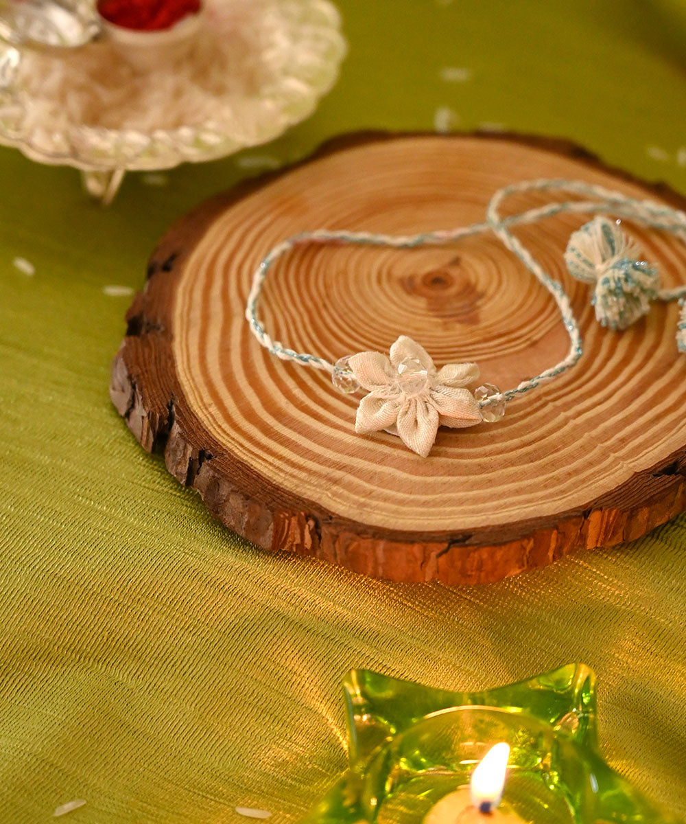 Cream handcrafted silk rakhi