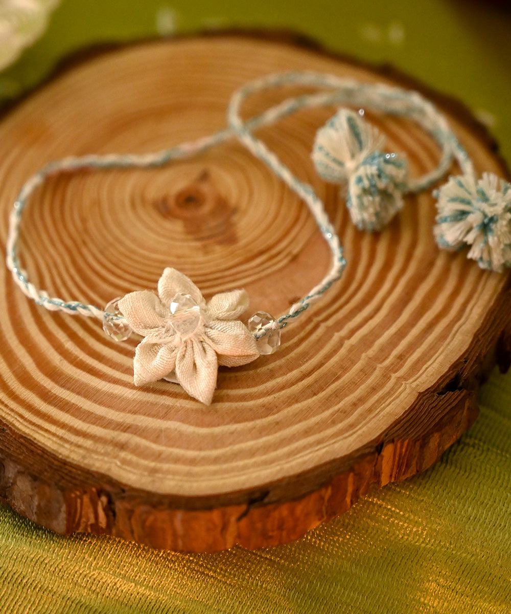 Cream handcrafted silk rakhi