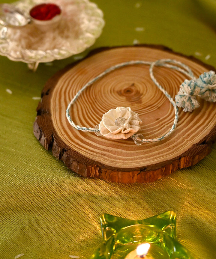 Cream hand crafted silk rakhi