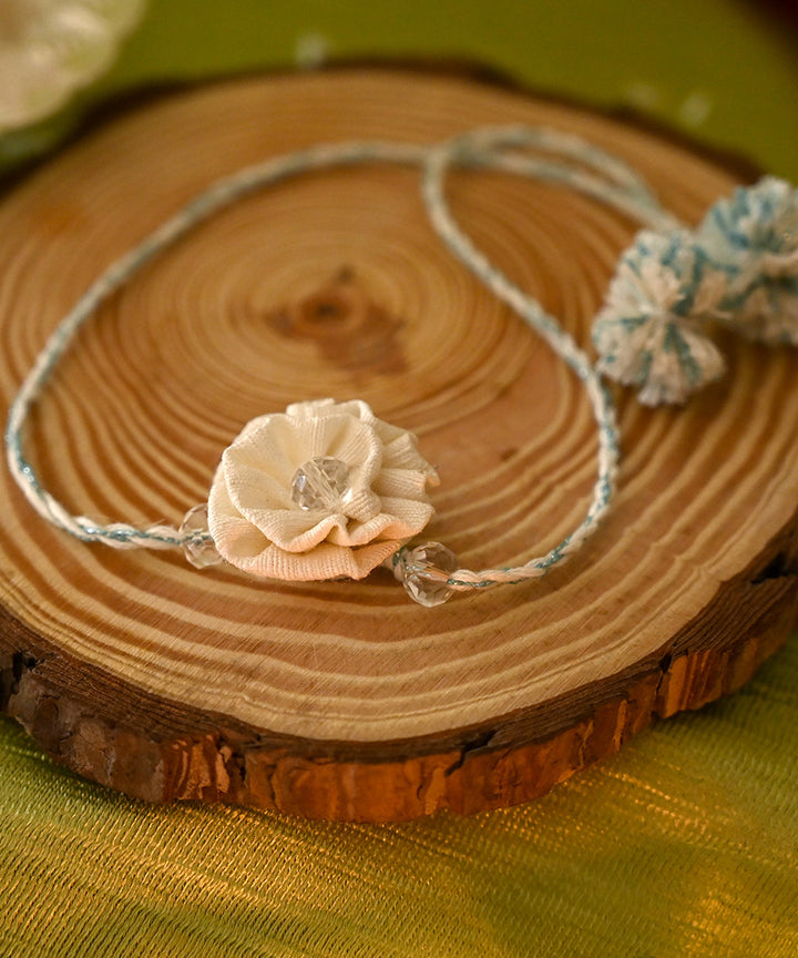 Cream hand crafted silk rakhi