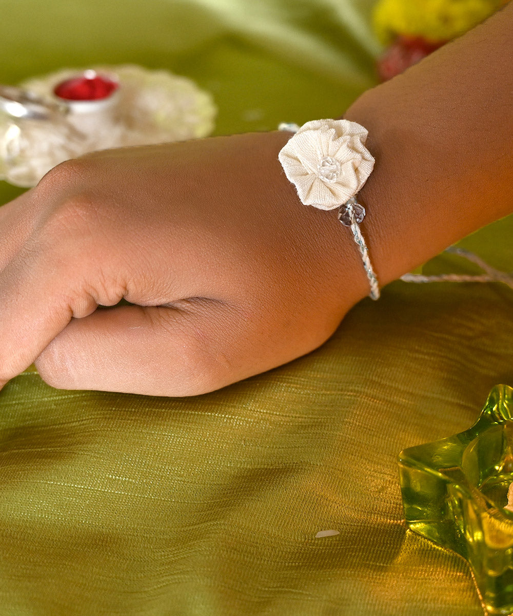 Cream hand crafted silk rakhi