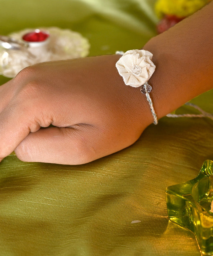 Cream hand crafted silk rakhi