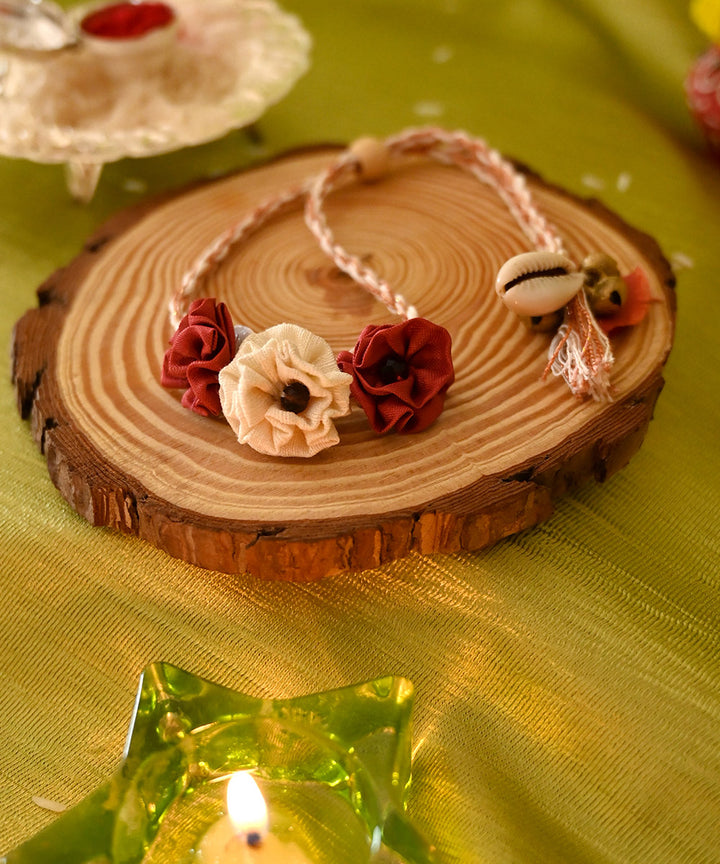 Dark red cream handcrafted silk rakhi