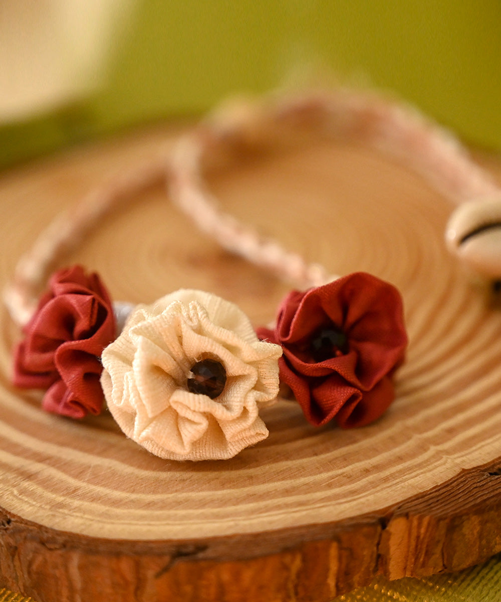 Dark red cream handcrafted silk rakhi