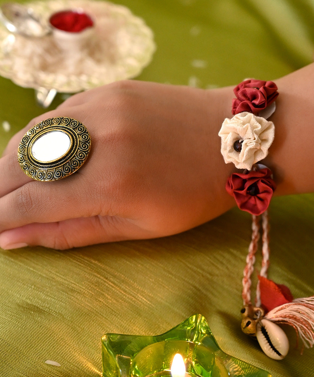 Dark red cream handcrafted silk rakhi