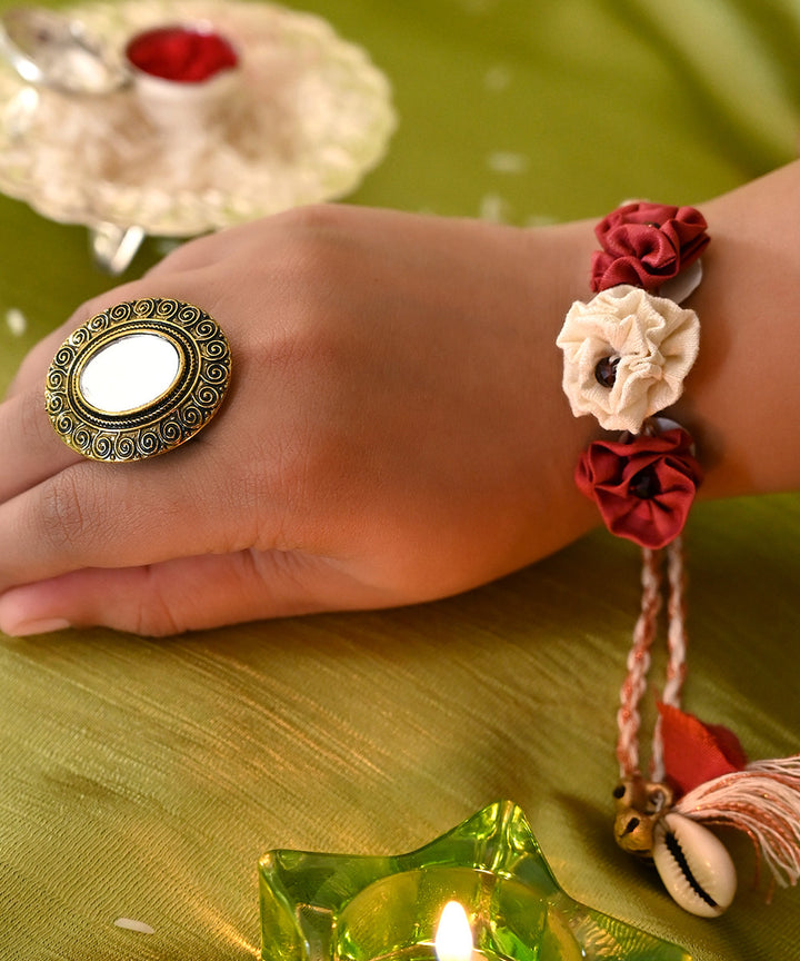 Dark red cream handcrafted silk rakhi