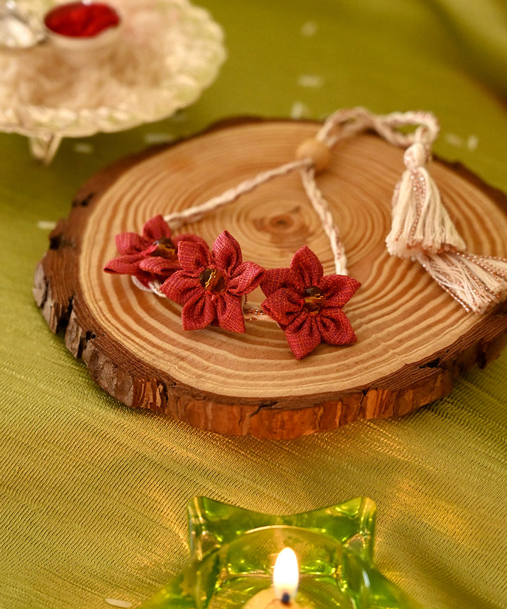 Handcrafted red cream silk rakhi