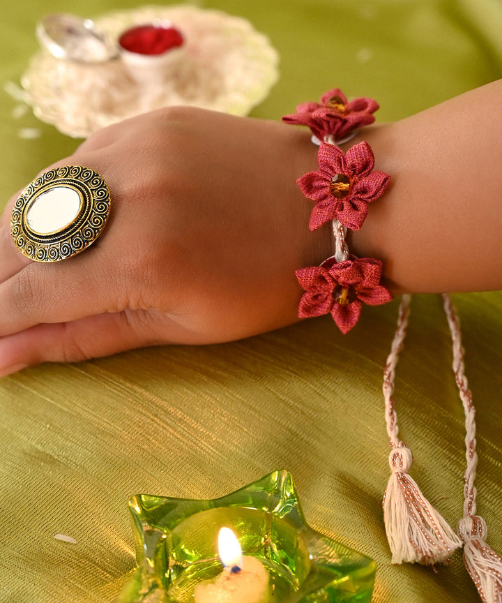 Handcrafted red cream silk rakhi