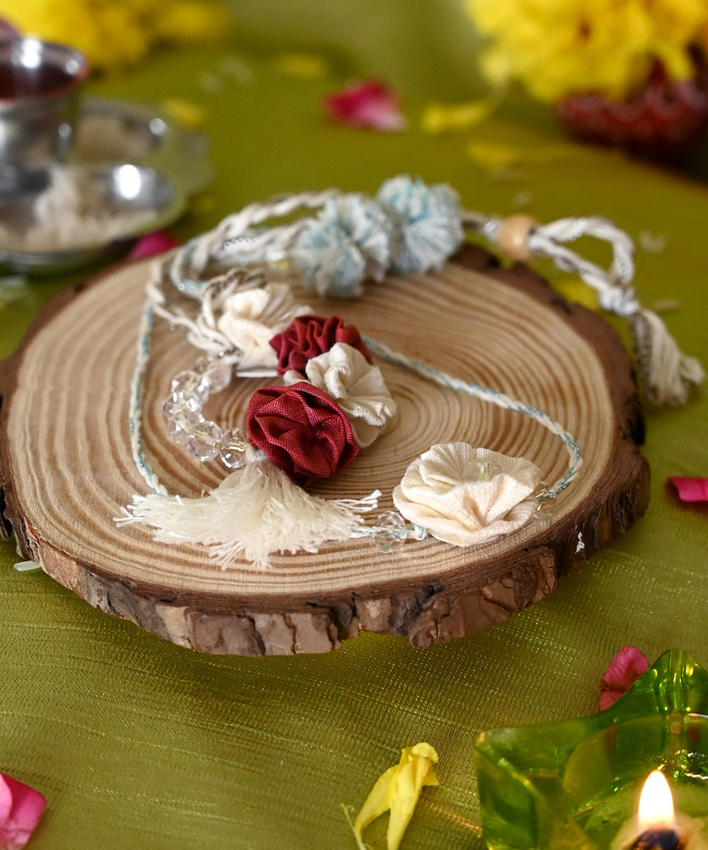 Hand crafted red cream silk rakhi