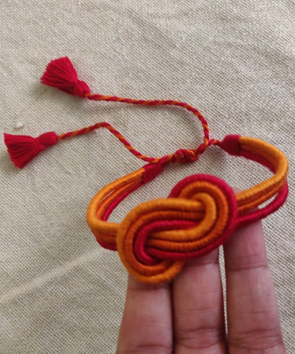 Handcrafted floral multicolor rakhi in mercerised cotton thread
