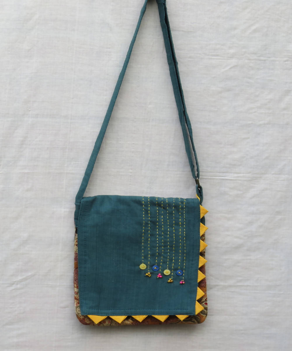 Teal green handmade cotton sling bag with thread work