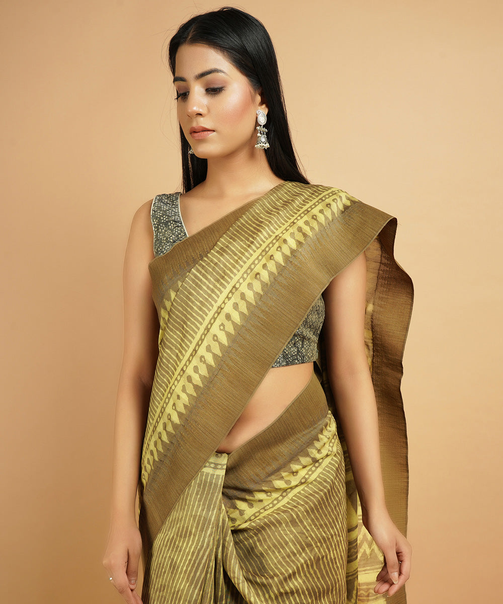 Olive green gheecha border cotton silk hand block dabu printed sari
