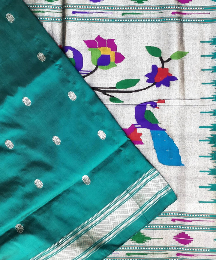 Bottle green silk paithani saree with silver zari flower motifs