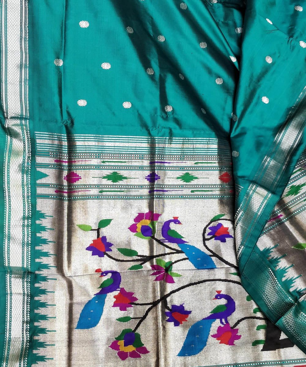Bottle green silk paithani saree with silver zari flower motifs