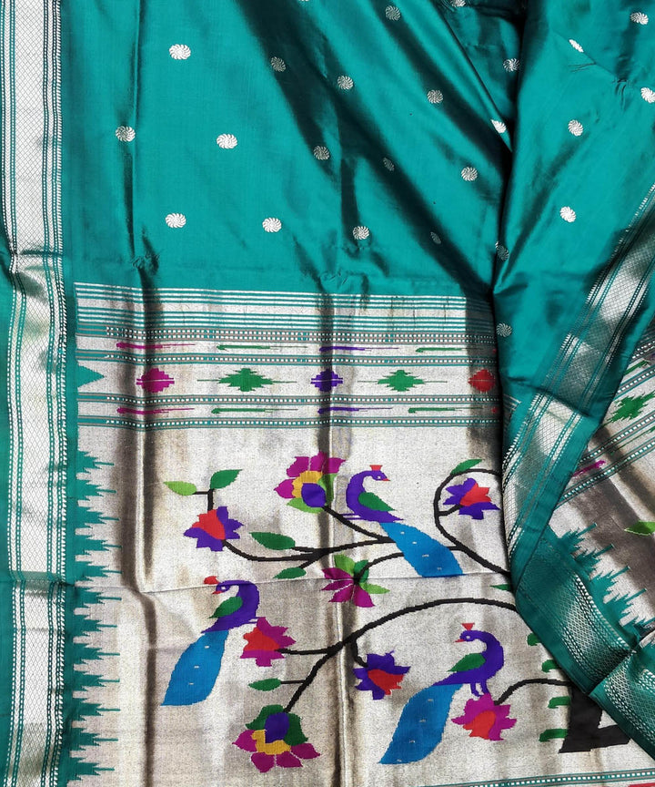 Bottle green silk paithani saree with silver zari flower motifs