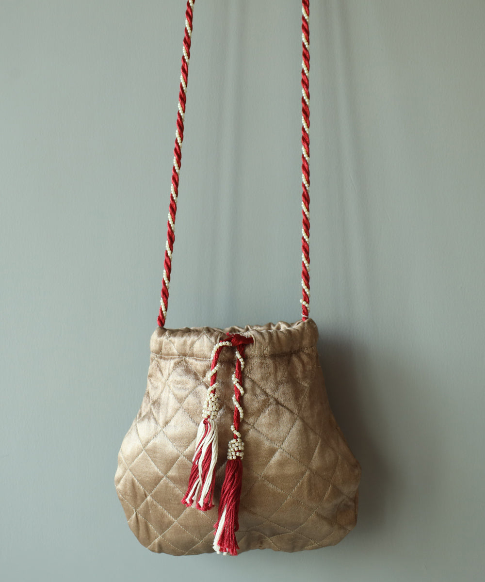 Golden hand embroidered cotton sling bag
