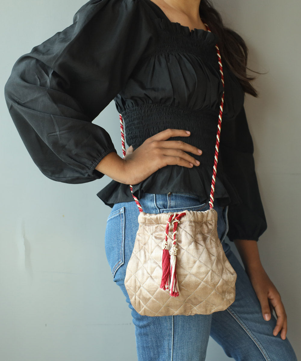 Golden hand embroidered cotton sling bag