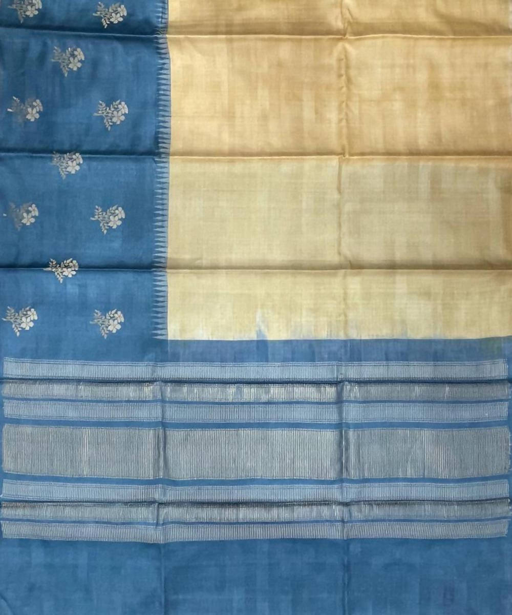 Cream and blue handwoven tussar silk saree with flower motif